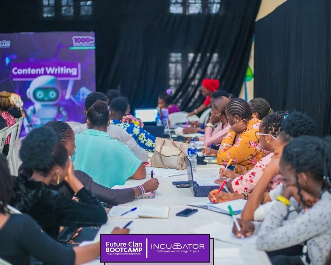 Women and learners collaborating during a tech training session