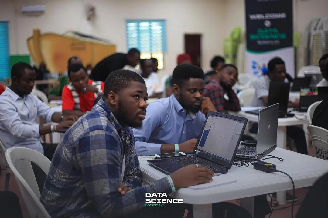 Learners engaging in a practical digital skills class