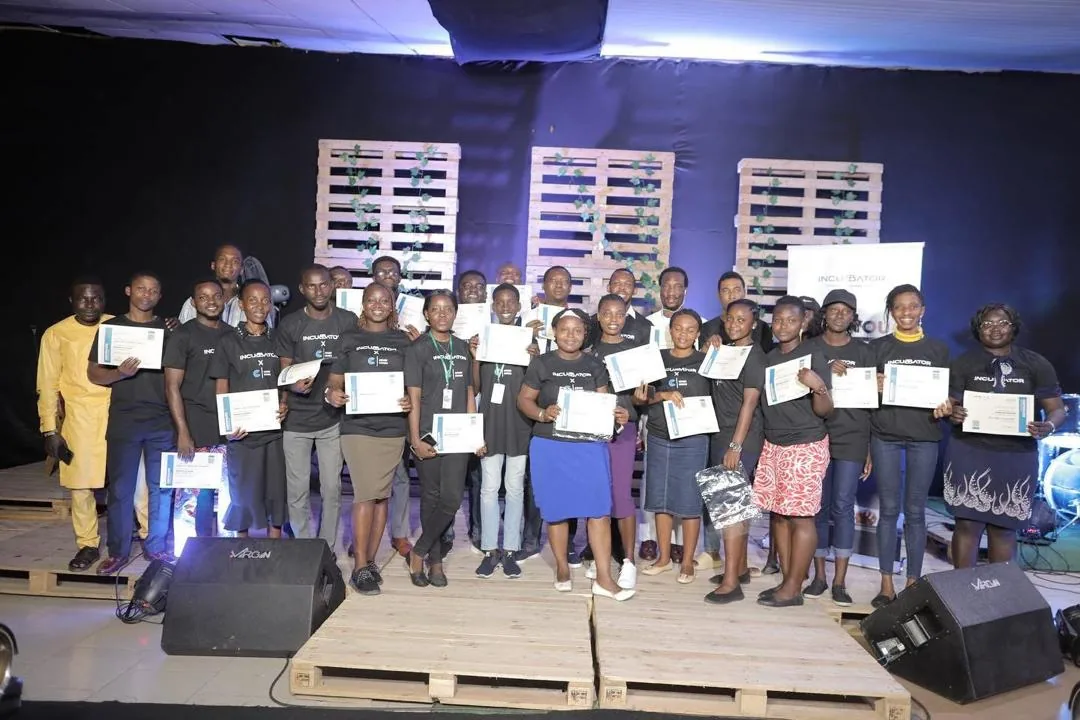 Bootcamp participants receiving recognition on stage